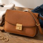 neutral colored purse black